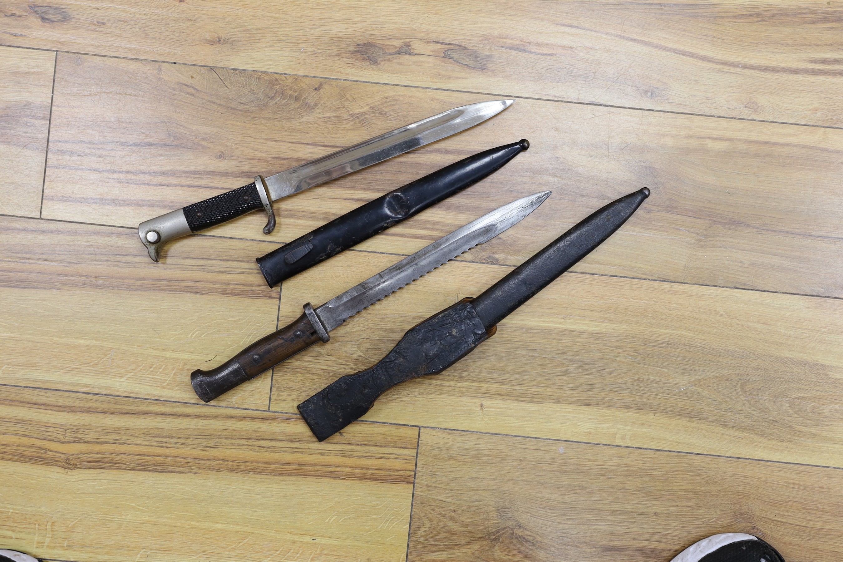 A 19th century Naval sword marked Wilkinson and a Hawks and Co. George V officer's dress sword and two bayonets